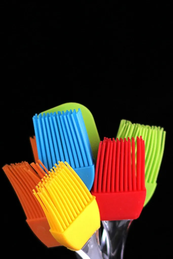 Colorful silicone kitchen brushes and spatula heads